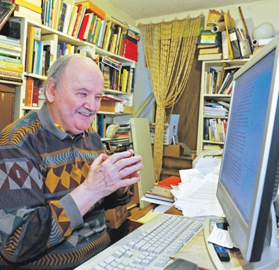 Chuck at his computer in his office