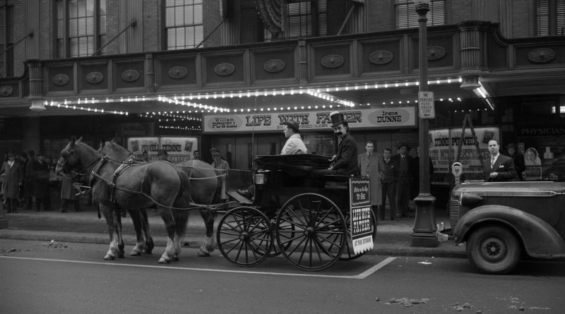 Actor in costume in a horse and carriage outside the Strand Theatre promoting "Life with Father"