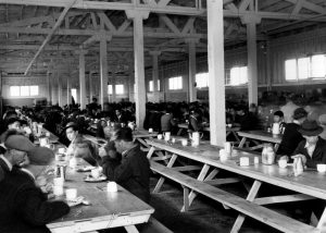 Japanese Canadian men and boys in mess hall, Forestry and Indian building, Building E, during Japanese Canadian internment and relocation [CVA 180-3544]